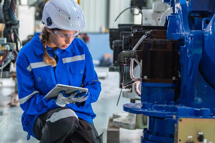 woman engineer in uniform helmet inspection check control heavy machine robot arm construction installation in industrial factory technician worker check for repair maintenance electronic operation | OMC GROUP